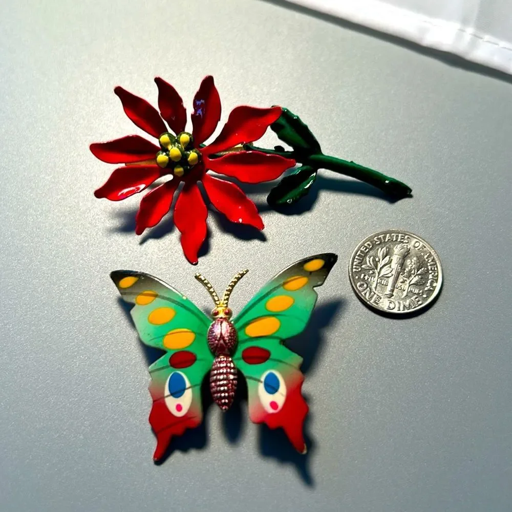 Vintage pointsettia and butterfly enamel on metal brooch set